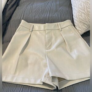 7 for all mankind leather looking beige shorts.